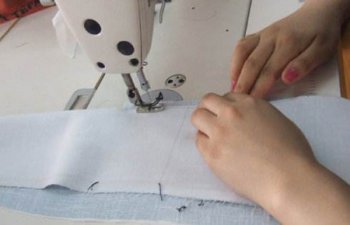 定做工作服生产当中的车缝倒回针有什么用?